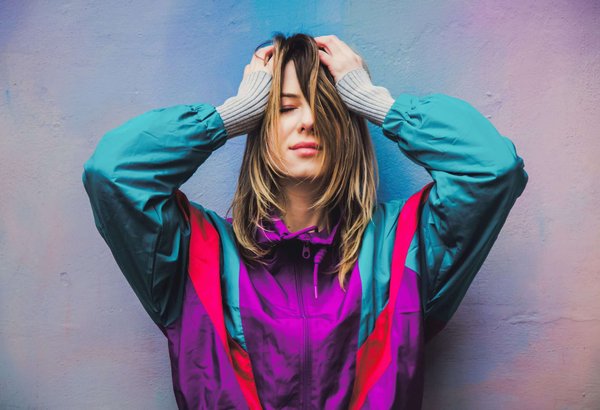 What Are the Most Effective Ways to Style a Basic Black Pantsuit for Various Office Occasions?